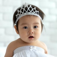 Portrait Of Cute Baby Girl Wearing Tiara