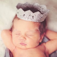 newborn baby wearing silver crown