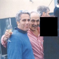 Jeffrey Epstein, Les Wexner and a person who has been redacted pose together in an undated photo.