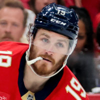 Matthew Tkachuk on the ice with the hockey puck in tow