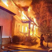 Firefighters battle a blaze at the home of Denny Hamlin’s father following a fatal house fire.