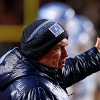 RALEIGH, NORTH CAROLINA - NOVEMBER 29: Head coach Bill Belichick of the North Carolina Tar Heels speaks with an official during the game against the NC State Wolfpack at Carter-Finley Stadium on November 29, 2025 in Raleigh, North Carolina. (Photo by Lance King/Getty Images)