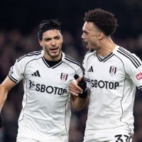 LONDON, ENGLAND - DECEMBER 22: Raúl Jiménez of Fulham celebrates with his teammate Antonee Robinson of Fulham after scoring his side's first goal during the Premier League match between Fulham and Nottingham Forest at Craven Cottage on December 22, 2025 in London, England. (Photo by Gaspafotos/MB Media/Getty Images)