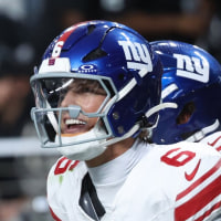 LAS VEGAS, NEVADA - DECEMBER 28: Jaxson Dart #6 of the New York Giants celebrates with teammates after scoring a touchdown during the fourth quarter of the game against the Las Vegas Raiders at Allegiant Stadium on December 28, 2025 in Las Vegas, Nevada. (Photo by Ian Maule/Getty Images)