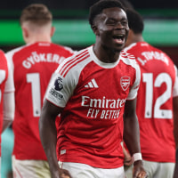 LONDON, ENGLAND - DECEMBER 13: Bukayo Saka of Arsenal celebrates after Sam Johnston of Wolverhampton Wanderers scores an own goal to make it 1-0 during the Premier League match between Arsenal and Wolverhampton Wanderers at Emirates Stadium on December 13, 2025 in London, England. (Photo by Catherine Ivill - AMA/Getty Images)