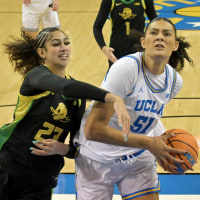 Dec 7, 2025; Los Angeles, California, USA;  UCLA Bruins center Lauren Betts (51) drives past Oregon Ducks forward Sarah Rambus (23) for a basket during the first half at Pauley Pavilion presented by Wescom Financial. Mandatory Credit: Jayne Kamin-Oncea-Imagn Images