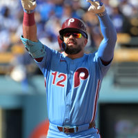 Oct 9, 2025; Los Angeles, California, USA; Philadelphia Phillies left fielder Kyle Schwarber (12) reacts after a double in the first inning against the Los Angeles Dodgers during game four of the NLDS round for the 2025 MLB playoffs at Dodger Stadium. Mandatory Credit: Jayne Kamin-Oncea-Imagn Images