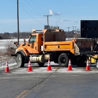 A head-on collision between a school bus and a passenger car Thursday morning in suburban Manhattan, Illinois left at least one person dead and 11 others, including students, sent to hospitals, with roads expected to be closed for hours as police investigate.