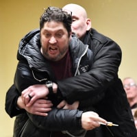 A man is tackled after spraying an unknown substance at US Representative Ilhan Omar