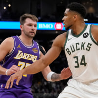 MILWAUKEE, WISCONSIN - NOVEMBER 15: Giannis Antetokounmpo #34 of the Milwaukee Bucks dribbles the ball against Luka Doncic #77 of the Los Angeles Lakers during the third quarter at Fiserv Forum on November 15, 2025 in Milwaukee, Wisconsin. NOTE TO USER: User expressly acknowledges and agrees that, by downloading and or using this photograph, User is consenting to the terms and conditions of the Getty Images License Agreement. (Photo by Patrick McDermott/Getty Images)