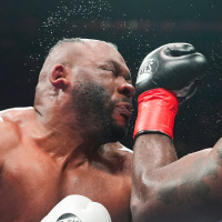 Kingsley Ibeh, right, punches Jarrell Miller in a boxing ring