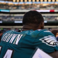 PHILADELPHIA, PA - DECEMBER 04: A.J. Brown #11 of the Philadelphia Eagles and Head coach Mike Vrabel of the Tennessee Titans hug after the game at Lincoln Financial Field on December 4, 2022 in Philadelphia, Pennsylvania. (Photo by Scott Taetsch/Getty Images)