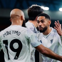 LIVERPOOL, ENGLAND - OCTOBER 19: Bryan Mbeumo and Matheus Cunha of Manchester United celebrate Harry Maguire scoring their second goal during the Premier League match between Liverpool and Manchester United at Anfield on October 19, 2025 in Liverpool, England. (Photo by Poppy Townson - MUFC/Manchester United via Getty Images)