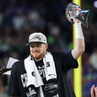 Football: Super Bowl LX: Seattle Seahawks Sam Darnold (14)  victorious on the podium with the Vince Lombardi trophy vs New England Patriots at Levi's Stadium. Santa Clara, CA 2/8/2026 CREDIT: Simon Bruty (Photo by Simon Bruty/Sports Illustrated via Getty Images) (Set Number: X164840)