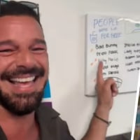 Ricky Martin spots his name on a sign at Sip 305 while Nascosi Rosemond spots the pop star.