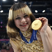 Alysa Liu poses with her gold medal in Milan on Feb. 19, 2026. 