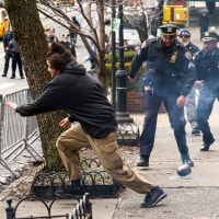 Person runs from police.
