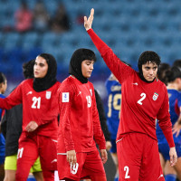 Atefeh Imani waves on the soccer field