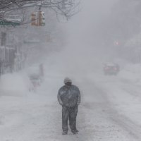 People walk in the snow