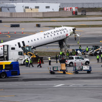 Air Canada Express Plane Collides With Fire Truck At LaGuardia Airport