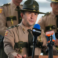 Major Travis Plotzer speaks during a Tennessee Highway Patrol press conference concerning a Clarksville-Montgomery County bus crash at Lake Halford in Huntingdon, Tenn., on Friday, Mar. 27, 2026.