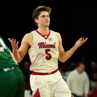 Miami RedHawks guard Peter Suder (5) reacts after hitting a jump shot over Ohio Bobcats guard Jesse Burris (21) in the second half of the NCAA basketball game at Millett Hall in Oxford, Ohio, on Friday, Feb. 13, 2026.