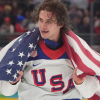 Feb 22, 2026; Milan, Italy; Jack Hughes (86) of the United States celebrates after defeating Canada in the men's ice hockey gold medal game during the Milano Cortina 2026 Olympic Winter Games at Milano Santagiulia Ice Hockey Arena. Mandatory Credit: Amber Searls-Imagn Images
