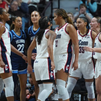 Mar 9, 2026; Uncasville, CT, USA; UConn Huskies forward Sarah Strong (21), guard Kk Arnold (2), guard Blanca Quinonez (4), guard Azzi Fudd (35) and guard Ashlynn Shade (12) react after a basket and one against the Villanova Wildcats in the first half at Mohegan Sun Arena. Mandatory Credit: David Butler II-Imagn Images