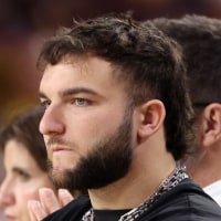 TEMPE, ARIZONA - JANUARY 31: NFL player Cam Skattebo watches the action during the game between the Arizona Wildcats and the Arizona State Sun Devils at Desert Financial Arena on January 31, 2026 in Tempe, Arizona. (Photo by Chris Coduto/Getty Images)