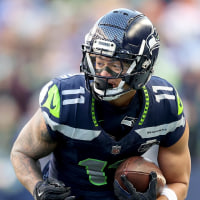 SEATTLE, WASHINGTON - JANUARY 25: Jaxon Smith-Njigba #11 of the Seattle Seahawks carries the ball against the Los Angeles Rams in the NFC Championship game at Lumen Field on January 25, 2026 in Seattle, Washington. (Photo by Steph Chambers/Getty Images)
