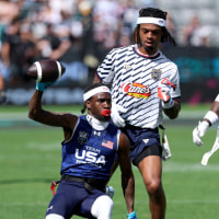 LOS ANGELES, CALIFORNIA - MARCH 21: Shawn Theard Jr. #19 of Team USA is chased by Ashton Jeanty #2 and Damar Hamlin #3 of Founders FFC during the Fanatics Flag Football Classic 2026 at BMO Stadium on March 21, 2026 in Los Angeles, California. (Photo by Harry How/Getty Images)