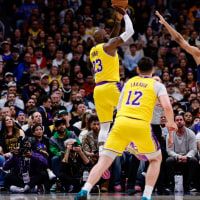 Mar 5, 2026; Denver, Colorado, USA; Los Angeles Lakers forward LeBron James (23) scores a basket over Denver Nuggets forward Zeke Nnaji (22) to break the NBA regular season field goals made record as forward Jake LaRavia (12) and guard Tim Hardaway Jr. (10) defend in the first quarter at Ball Arena. The record was held by Kareem Abdul-Jabbar with 15,835 made field goals. Mandatory Credit: Isaiah J. Downing-Imagn Images