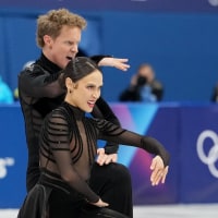 Feb 7, 2026; Milan, Italy; Madison Chock and Evan Bates of the United States of America compete in mixed team free dance during the Milano Cortina 2026 Olympic Winter Games at Milano Ice Skating Arena. Mandatory Credit: James Lang-Imagn Images