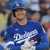Mar 24, 2026; Los Angeles, California, USA;  Los Angeles Dodgers two-way player Shohei Ohtani (17) on deck in the fourth against the Los Angeles Angels at Dodger Stadium. Mandatory Credit: Jayne Kamin-Oncea-Imagn Images