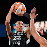 Oct 5, 2025; Las Vegas, Nevada, USA; Las Vegas Aces center A'ja Wilson (22) shoots the ball against Phoenix Mercury forward Alyssa Thomas (25) during the fourth quarter of game two of the 2025 WNBA Finals at Michelob Ultra Arena. Mandatory Credit: Lucas Peltier-Imagn Images