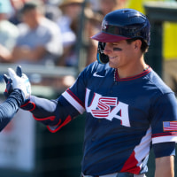 Mar 3, 2026; Scottsdale, AZ, USA; Team USA third baseman Alex Bregman (2) celebrates with teammate Roman Anthony after hitting a home run against the San Francisco Giants during a spring training game at Scottsdale Stadium. Mandatory Credit: Mark J. Rebilas-Imagn Images