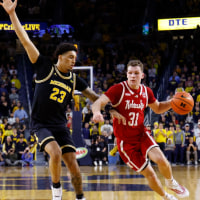 Jan 27, 2026; Ann Arbor, Michigan, USA; Nebraska Cornhuskers guard Cale Jacobsen (31) dribbles defended by Michigan Wolverines forward Yaxel Lendeborg (23) in the second half at Crisler Center. Mandatory Credit: Rick Osentoski-Imagn Images
