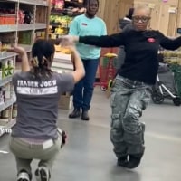 Kavita Johnson and A'ja Desormeau dance in Trader Joe's in Harlem.
