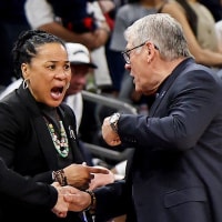 Dawn Staley of the South Carolina Gamecocks and head coach Geno Auriemma of the UConn Huskies.