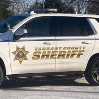 A Tarrant County Sheriff police vehicle parked outside during the day