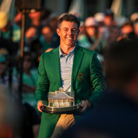 Image: Rory McIlroy of Northern Ireland reacts with the Masters Trophy during the Green Jacket Ceremony
