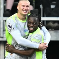 Manchester City's Norwegian striker #09 Erling Haaland (L) celebrates scoring the team's first goal during the English Premier League football match between Burnley and Manchester City at Turf Moor in Burnley, north-west England on April 22, 2026. (Photo by Paul ELLIS / AFP via Getty Images) / RESTRICTED TO EDITORIAL USE. No use with unauthorized audio, video, data, fixture lists, club/league logos or 'live' services. Online in-match use limited to 120 images. An additional 40 images may be used in extra time. No video emulation. Social media in-match use limited to 120 images. An additional 40 images may be used in extra time. No use in betting publications, games or single club/league/player publications. /