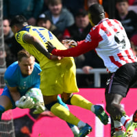 Tottenham Hotspur's Argentinian defender #17 Cristian Romero (2L) and Tottenham Hotspur's Czech goalkeeper #31 Antonin Kinsky (L) collide during the English Premier League football match between Sunderland and Tottenham Hotspur at The Stadium of Light in Sunderland in north east England on April 12, 2026. (Photo by ANDY BUCHANAN / AFP via Getty Images) / RESTRICTED TO EDITORIAL USE. No use with unauthorized audio, video, data, fixture lists, club/league logos or 'live' services. Online in-match use limited to 120 images. An additional 40 images may be used in extra time. No video emulation. Social media in-match use limited to 120 images. An additional 40 images may be used in extra time. No use in betting publications, games or single club/league/player publications. /