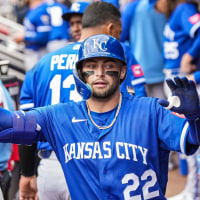 Mar 29, 2026; Cumberland, Georgia, USA; Kansas City Royals catcher Carter Jensen (22) reacts in the dugout after driving in a run with a sacrifice fly against the Atlanta Braves during the eighth inning at Truist Park. Mandatory Credit: Dale Zanine-Imagn Images