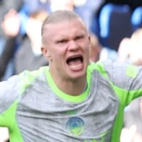 LONDON, ENGLAND - APRIL 12: Erling Haaland of Manchester City celebrates his side's first goal scored by Nico O'Reilly of Manchester City during the Premier League match between Chelsea and Manchester City at Stamford Bridge on April 12, 2026 in London, England. (Photo by Ryan Pierse/Getty Images)