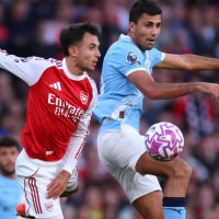 LONDON, ENGLAND - SEPTEMBER 21: Ruben Dias of Manchester City in action with Martin Zubimendi of Arsenal during the Premier League match between Arsenal and Manchester City at Emirates Stadium on September 21, 2025 in London, England. (Photo by Marc Atkins/Getty Images)