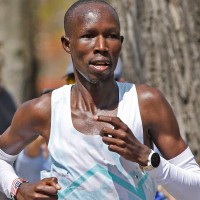 Apr 21, 2025; Newton, MA, Kenyan John Korir in the lead as he runs up Heartbreak Hill during the 129th running of the Boston Marathon at Heartbreak Hill in Newton, April 21, 2025.. Mandatory Credit: Greg Derr-USA Today Network
