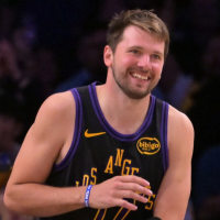 Mar 31, 2026; Los Angeles, California, USA; Los Angeles Lakers guard Luka Doncic (77) smiles after a dunk in the final minutes of the game against the Cleveland Cavaliers at Crypto.com Arena. Mandatory Credit: Jayne Kamin-Oncea-Imagn Images