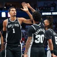 Oct 22, 2025; Dallas, Texas, USA; San Antonio Spurs forward Victor Wembanyama (1) celebrates with San Antonio Spurs forward Julian Champagnie (30) and San Antonio Spurs guard Stephon Castle (5) and San Antonio Spurs forward Harrison Barnes (40) during the second half against the Dallas Mavericks at American Airlines Center. Mandatory Credit: Kevin Jairaj-Imagn Images
