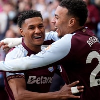 Aston Villa's Morgan Rogers celebrates scoring their side's third goal of the game with teammate Ollie Watkins during the Premier League match at Villa Park, Birmingham. Picture date: Sunday April 19, 2026. (Photo by Joe Giddens/PA Images via Getty Images)